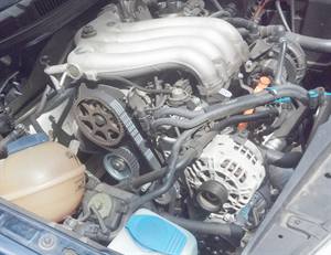 A 2.0L engine with the timing belt cover removed.